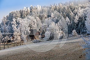 Lodge in an alpine region, covered with hoar frost, rime