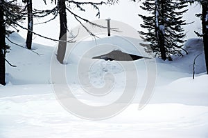 Lodges, landscape, ice, snow roof background, winter in Dolomiti mountains, in Cadore, Italy