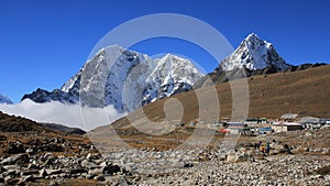 Lodges in Lobuche and snow covered mountains Tobuche, Taboche and Cholatse