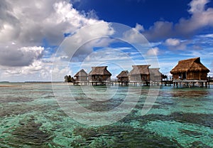 Lodges over transparent quiet sea water- tropical paradise, Maldives