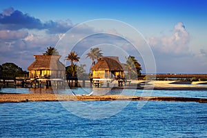 Lodges over transparent quiet sea water- tropical paradise, Maldives