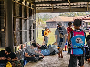 Unacquainted  trekkers waiting to pick them Bag from poster man on Phu Kradueng mountain national park in Loei City Thailand