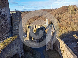 Loewenburg castle ruins with a view of the Philippsburg ruins in Monreal on a beautiful sunny autumn morning photo