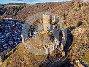 Loewenburg castle ruins with a view of the Philippsburg ruins in Monreal on a beautiful sunny autumn morning