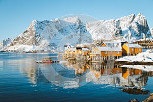 Lofoten winter scenery with traditional fisherman Rorbuer cabins, Sakrisoy, village of Reine, Norway