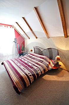 Loft or attic bedroom with slanted roof