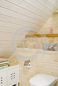 Loft bathroom with wooden ceiling detail