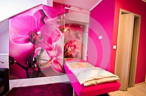 Loft bedroom conversion with orchid theme