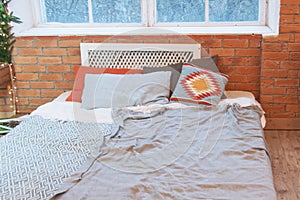 Loft design of interior bedroom studio with wall of bricks and plants