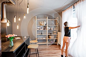 Loft dinning room with blurred woman