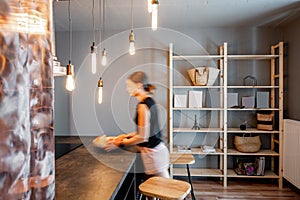 Loft dinning room with blurred woman