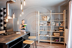 Loft dinning room with blurred woman