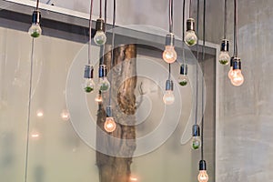 Loft interior details. hanging lamps with lights on