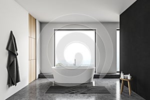 Loft white and black bathroom with tub