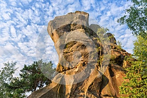 Lofty rock bludgeon against blue sky in the PrzÄ…dki nature reserve