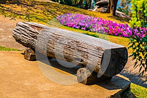 Log bench in park