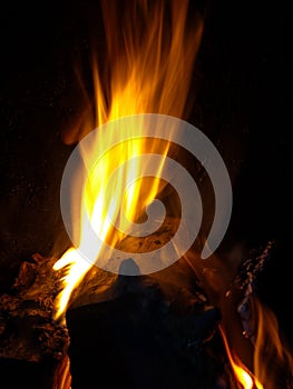 Log burning on fire at night
