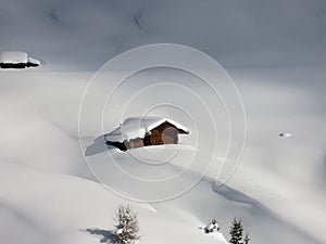 Log Cabin in deep snow in South Tyrol Alps