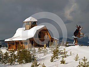 Log Cabin and Eagle Sculpture