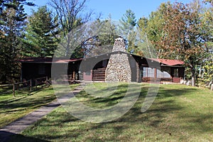 A Log Cabin with a Field Stone Fireplace