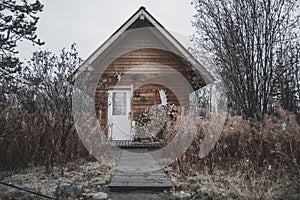 A log cabin in the middle of brown autumn Colors