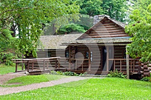 Log cabin in woods photo