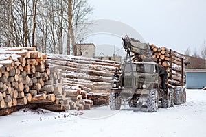 Log loader track with timber