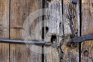 Log old house Doors, gates Forged rusty metal door handles, bolts, hinges, hooks