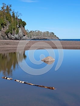 Log and Rock in Mouth of River