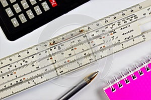Logarithmic calculations at school in the classroom. The slide rule allows you to perform mathematical calculations, a calculator