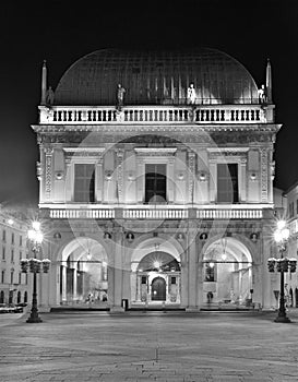 Loggia Palace in Brescia at night, black and white photo