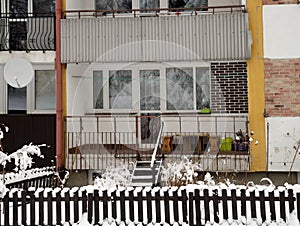 Loggias of apartment house with front garden in winter, Poland photo