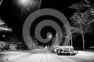 Logging trailers parked on a street