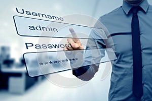 Login box - finger pushing username and password fields photo