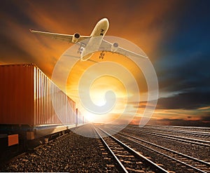 Logistic  trains and cargo plane flying against beautiful sky background