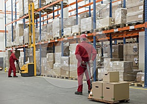 Logistic - workers in storehouse photo