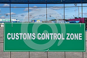 Logistics complex behind the green sign, customs control zone.