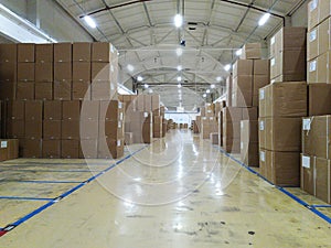 Logistics concept. A large group of cardboard boxes stacked on top of each other in a large logistics warehouse