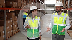 Logistics managers walking through warehouse