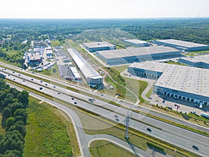 Logistics park with warehouse. Semi-trailers trucks standing on car