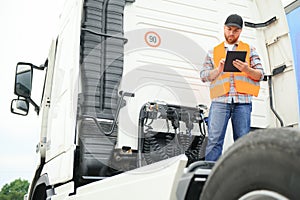 Logistics - proud driver with tablet computer.