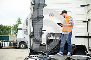 Logistics - proud driver with tablet computer.