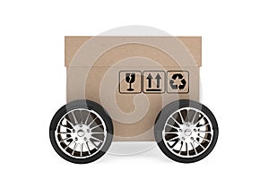 Logistics, Shipping and Delivery concept. Cardboard box with wheels