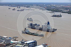 Logistics and shipping transportation on river, Oil gas tanker and goods ships vessel on river to the ocean.