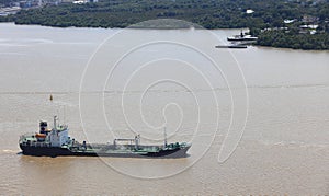 Logistics and shipping transportation on river, Oil gas tanker and goods ships vessel on river to the ocean.