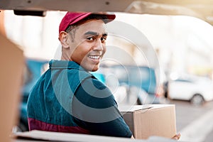 Logistics, smile and man with box at van looking back, trust and success in courier service for ecommerce business