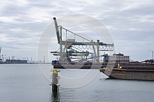 Logistics and transportation of Container Cargo ship and Cargo plane with working crane bridge in shipyard