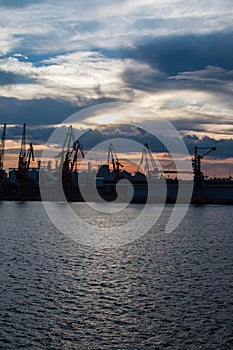 Logistics and transportation of International Container ship in the ocean at twilight sky