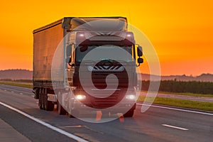 Logistics truck on the highway at dawn