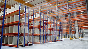 logistics warehouse with empty high racks